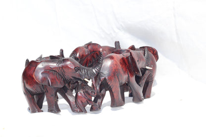 6 Adults, 3 Calfs Olive Wood Carved Continueous Circle Elephant Herd Decor ornaments. Dark brown handcarved African Art decor. Safari Gifts