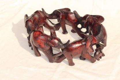 6 Adults, 3 Calfs Olive Wood Carved Continueous Circle Elephant Herd Decor ornaments. Dark brown handcarved African Art decor. Safari Gifts