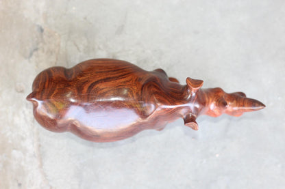 Zambian Teak wood Rhino Sculpture. Handcarved Rhinoceros figurines made from a reddish brown Wood with amazing visible grains.