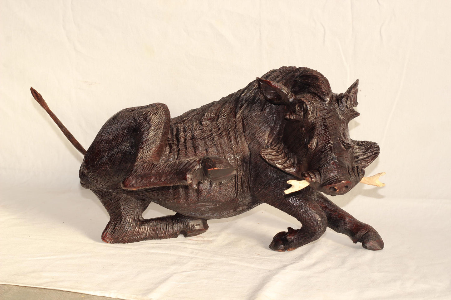 Fine Art Dark Brown Scratching Warthog Figurine. Fully detailed realistic lifelike Wooden Sculpture. Zimbabwean handcarved home/office decor
