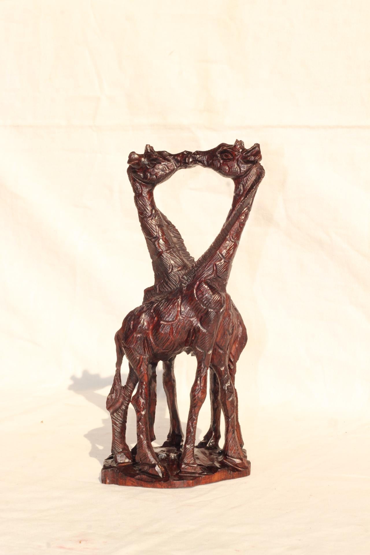 Kissing Giraffe Lovers Dark Brown Iron Wood Art figurines. Zimbabwean home decor handcarved Sculptures. Engagement/ Wedding African gifts