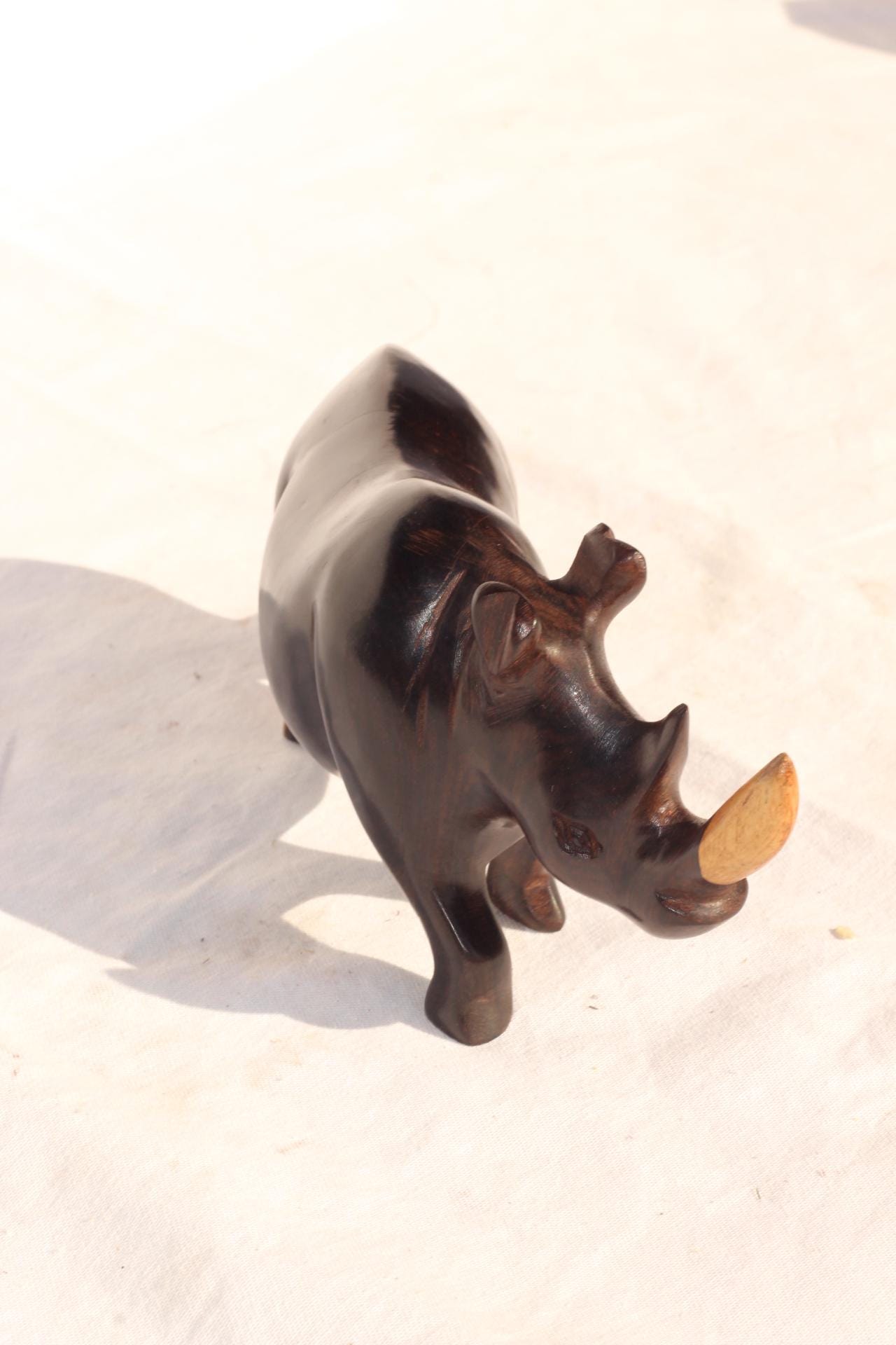 Smooth Zambian Ebony wood Multi coloured, Walking open mouth handcarved Rhino. Unique African Art Christmas Gifts, for home/office decor.