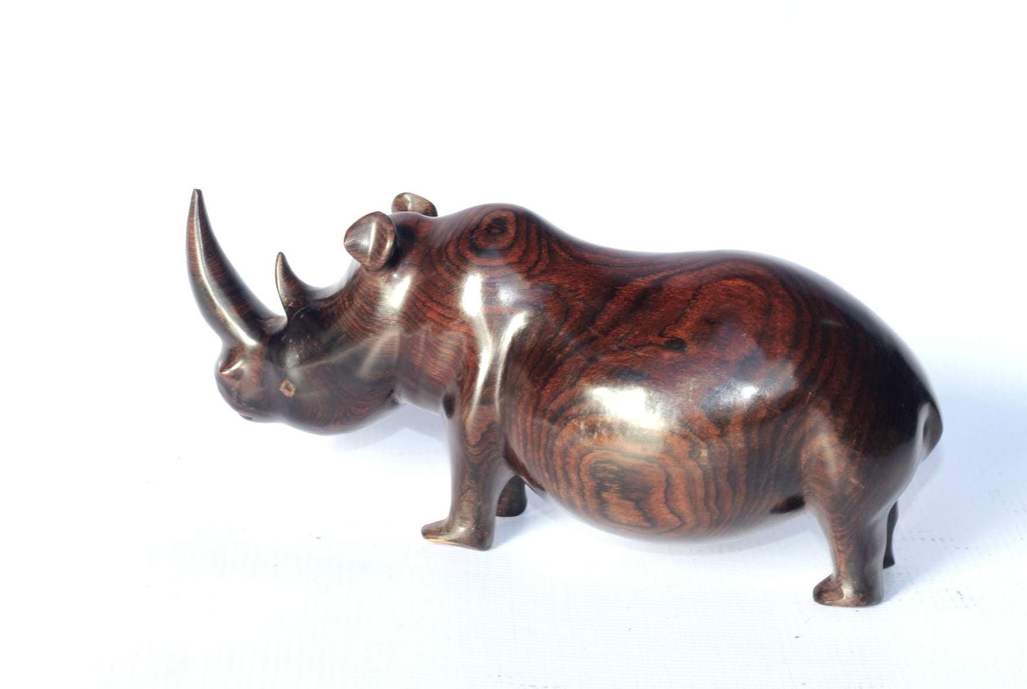Smooth Chubby Zambian Ebony wood handcarved Rhino. Unique African Art Gifts, home and office decor. Walking Long Horn Rhinoceros figurines.