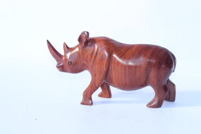 Zambian Teak wood Rhino Sculpture. Handcarved Rhinoceros figurines made from a reddish brown Wood with amazing visible grains. African Decor
