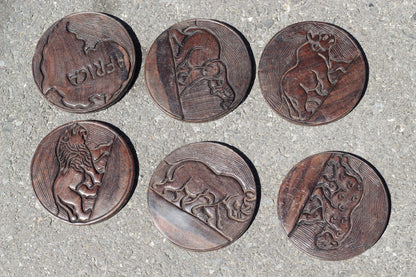 15" Iron wood Carved Coasters Set in a case. Big Five Animals on the lid and Coasters with Rhino, Elephant and Tiger Carved on the container