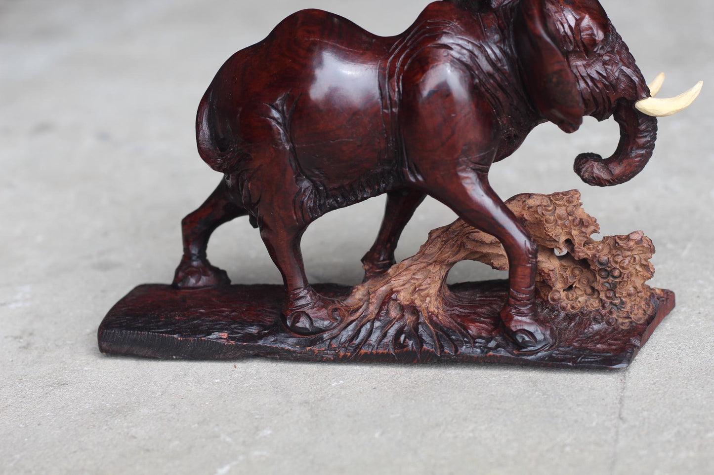 Smooth handcarved Elephant walking over a fallen tree. Ironwood dark brown Sculpture. Zimbabwe/African Art Décor unique gift ready to Ship