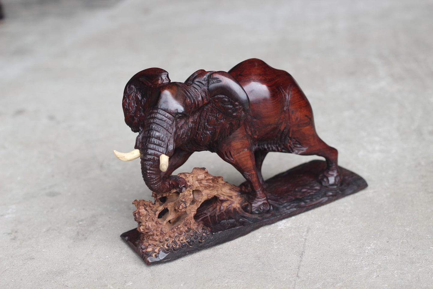 Smooth handcarved Elephant walking over a fallen tree. Ironwood dark brown Sculpture. Zimbabwe/African Art Décor unique gift ready to Ship