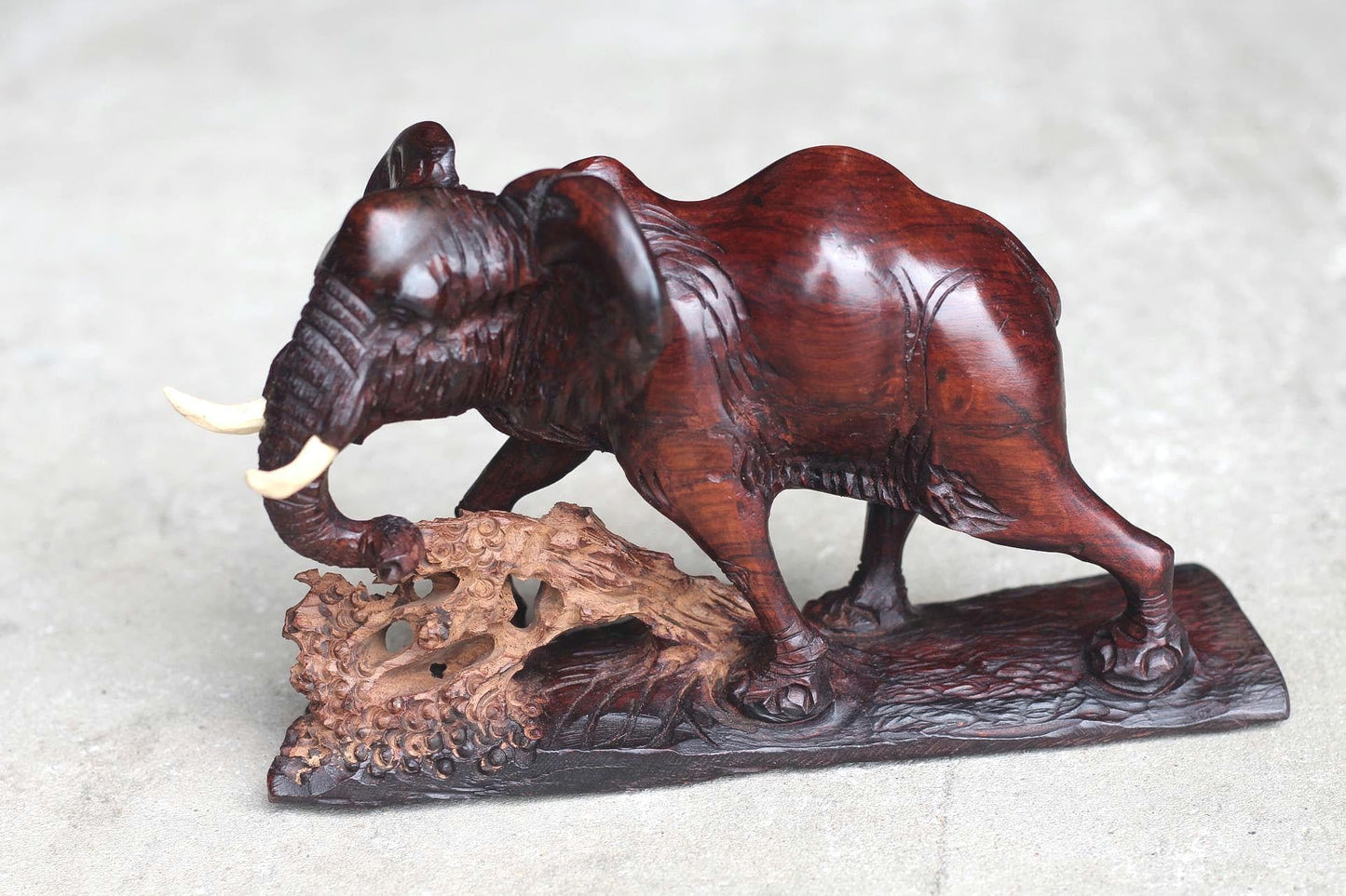 Smooth handcarved Elephant walking over a fallen tree. Ironwood dark brown Sculpture. Zimbabwe/African Art Décor unique gift ready to Ship