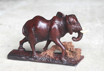 Smooth handcarved Elephant walking over a fallen tree. Ironwood dark brown Sculpture. Zimbabwe/African Art Décor unique gift ready to Ship