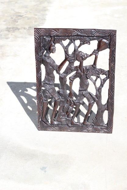 African Village Life Frame with a man carrying Fish and Lady with child. Malawian Dark Iron Wood Detailed Handcarved Wall Art Gifts