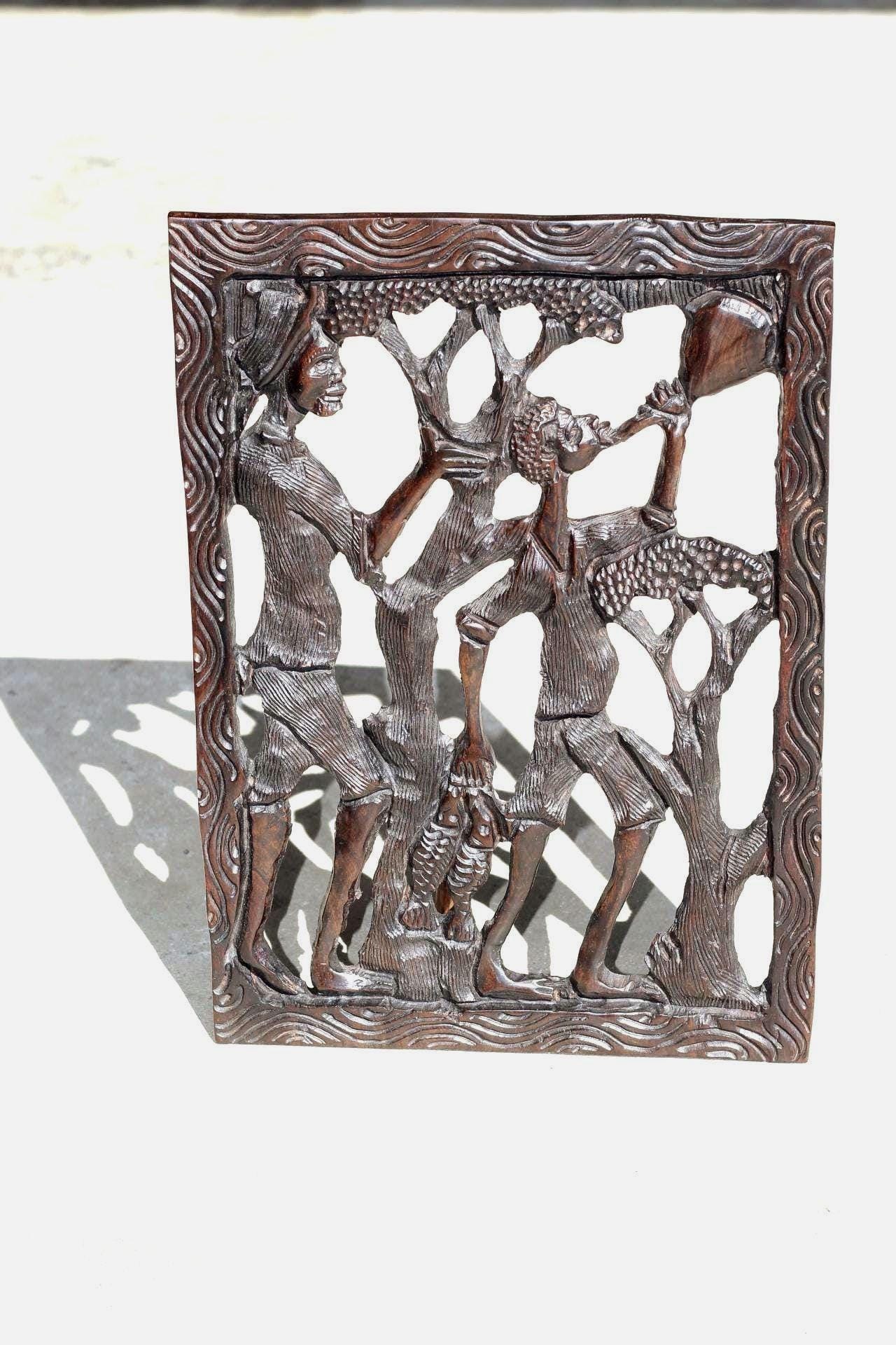 African Village Life Frame with a man carrying Fish and Lady with child. Malawian Dark Iron Wood Detailed Handcarved Wall Art Gifts