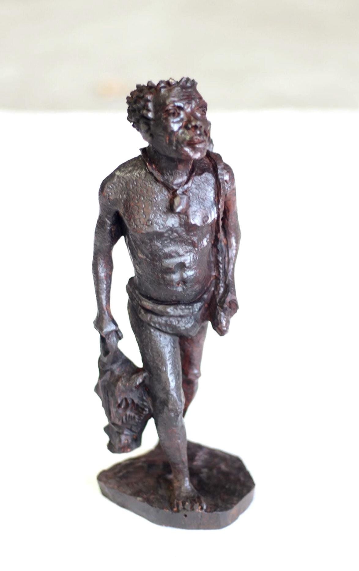 Iron wood Handcarved Khoisan Hunter carrying his Catch (Antelope) and Spears. Ready to Ship African Art Gifts.