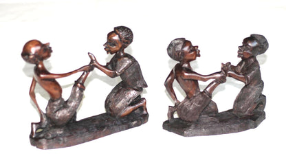 African Village Couple love story. Wife helps husband by removing thorns after working. Handmade Ironwood African Art Sculptures/Figurines.