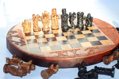 African Hunters Round Foldable Chess Board with Mixed Animal and Warriors Players. Zimbabwean handcarved gaming gift. Olive, Ebony, Mahogany
